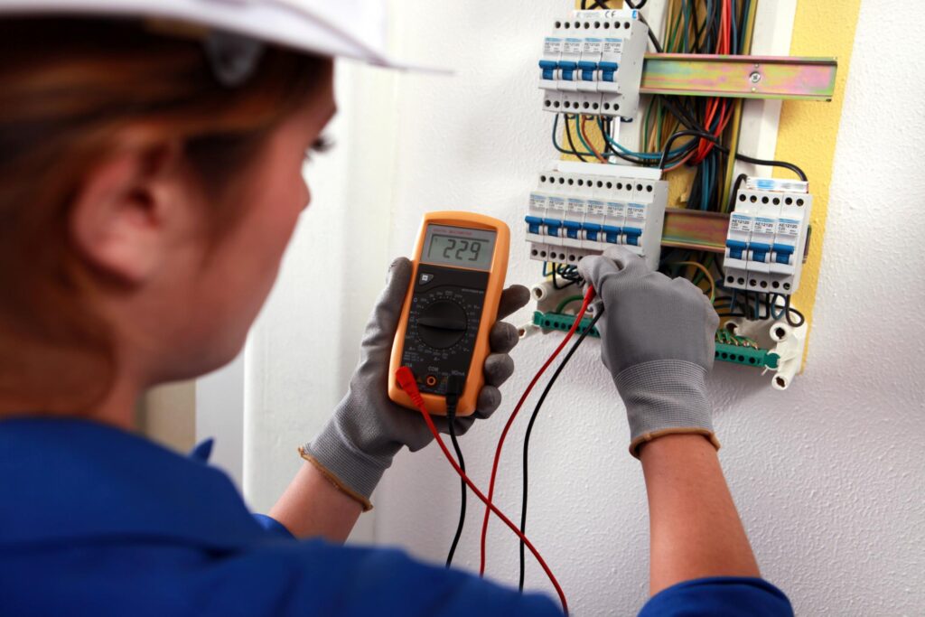 man testing the electrical wiring